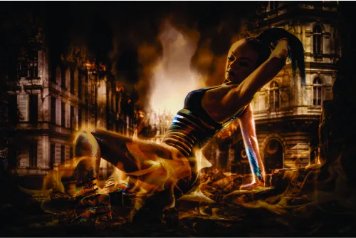 A figure performs an acrobatic backflip amid towering flames and burning buildings in a golden-lit urban setting.