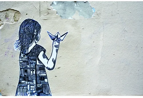 A stencilled line drawing of a girl with long hair, rendered in navy blue, holding up a star on a cream-coloured weathered concrete background.