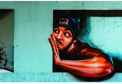 Street art portrait of a person with hand to face in red and black against a distressed turquoise wall.