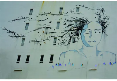 Street art style illustration of a profile head in blue with black tangled branches and flying birds emerging from the top, set against a cream background with geometric window shapes.