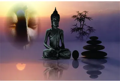 A silhouetted Buddha statue sits beside a pyramid of stacked grey stones and bamboo plant against a gradient sunset sky of pink, purple and gold.
